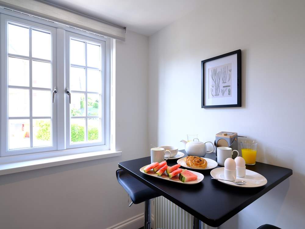 A breakfast-bar for two in the kitchen, perfect for a cosy chat.