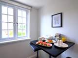 A breakfast-bar for two in the kitchen, perfect for a cosy chat.