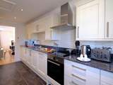 The well-equipped kitchen is off the living-room.