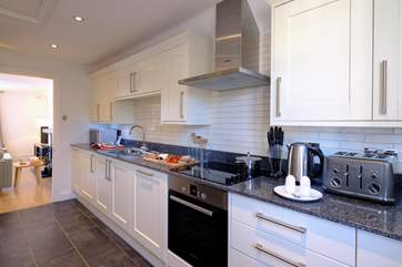 The well-equipped kitchen is off the living-room.