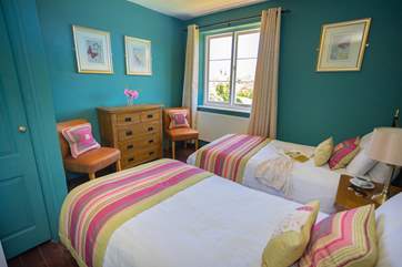 Bedroom four is a lovely colourful room with twin beds.