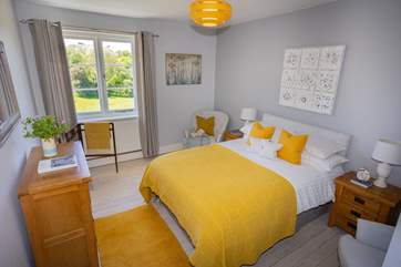 Stylish linens adorn this lovely bed.