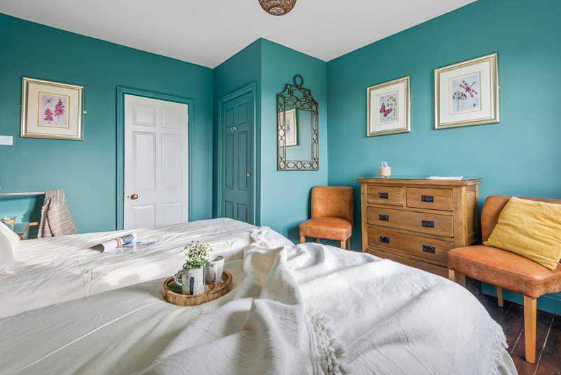 Bedroom four is beautifully furnished with twin beds.
