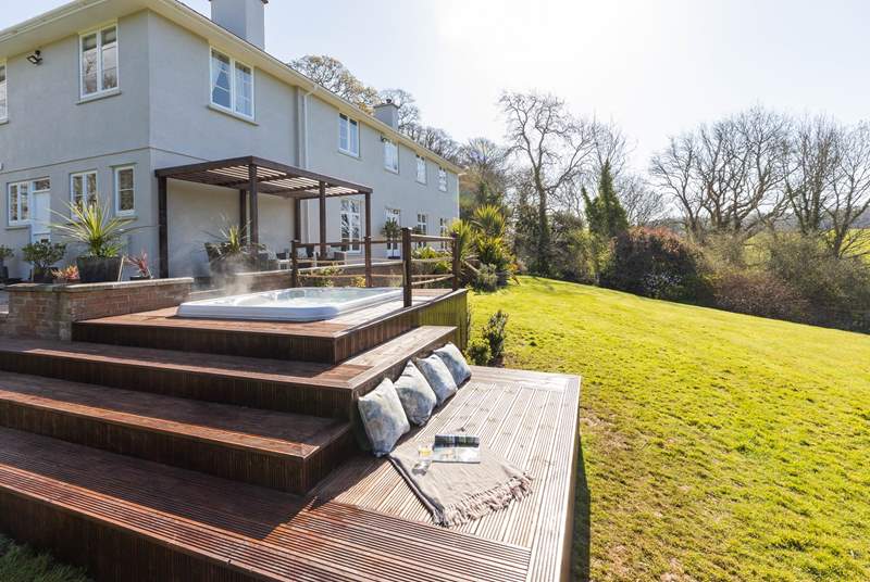 The decking has extra seating built in so you can sit back and relax either in or out of the hot tub.