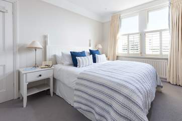 One of the beautifully arranged bedrooms with coastal colours and textures to enjoy.