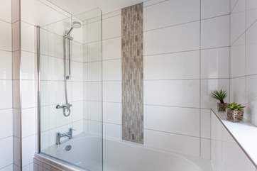 The lovely contemporary family bathroom.