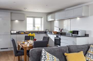 The open plan kitchen area is the perfect place to enjoy long chilled evenings.
