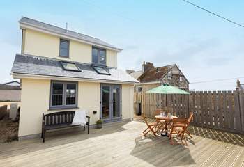 Relax on the decking and soak up the sunshine.