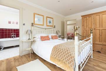 The comfortable en suite main bedroom.