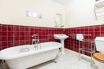 The en suite bathroom with luxurious roll-top bath.