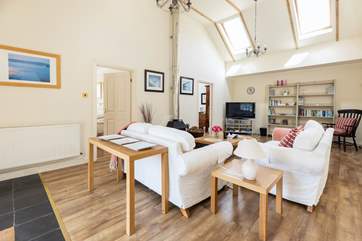 The cosy sitting-room with the added luxury of a wood-burner.