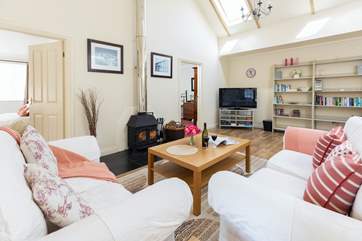 Flooded with natural daylight, the sitting-room is comfortable and relaxing.