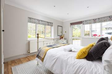 The dual-aspect main bedroom has lovely countryside views.