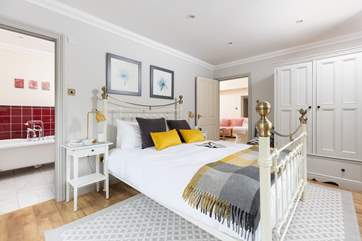 The comfortable en suite main bedroom.