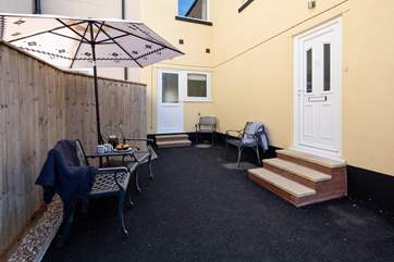 The entrance to Seashells is on the right. This is a shared courtyard entrance.