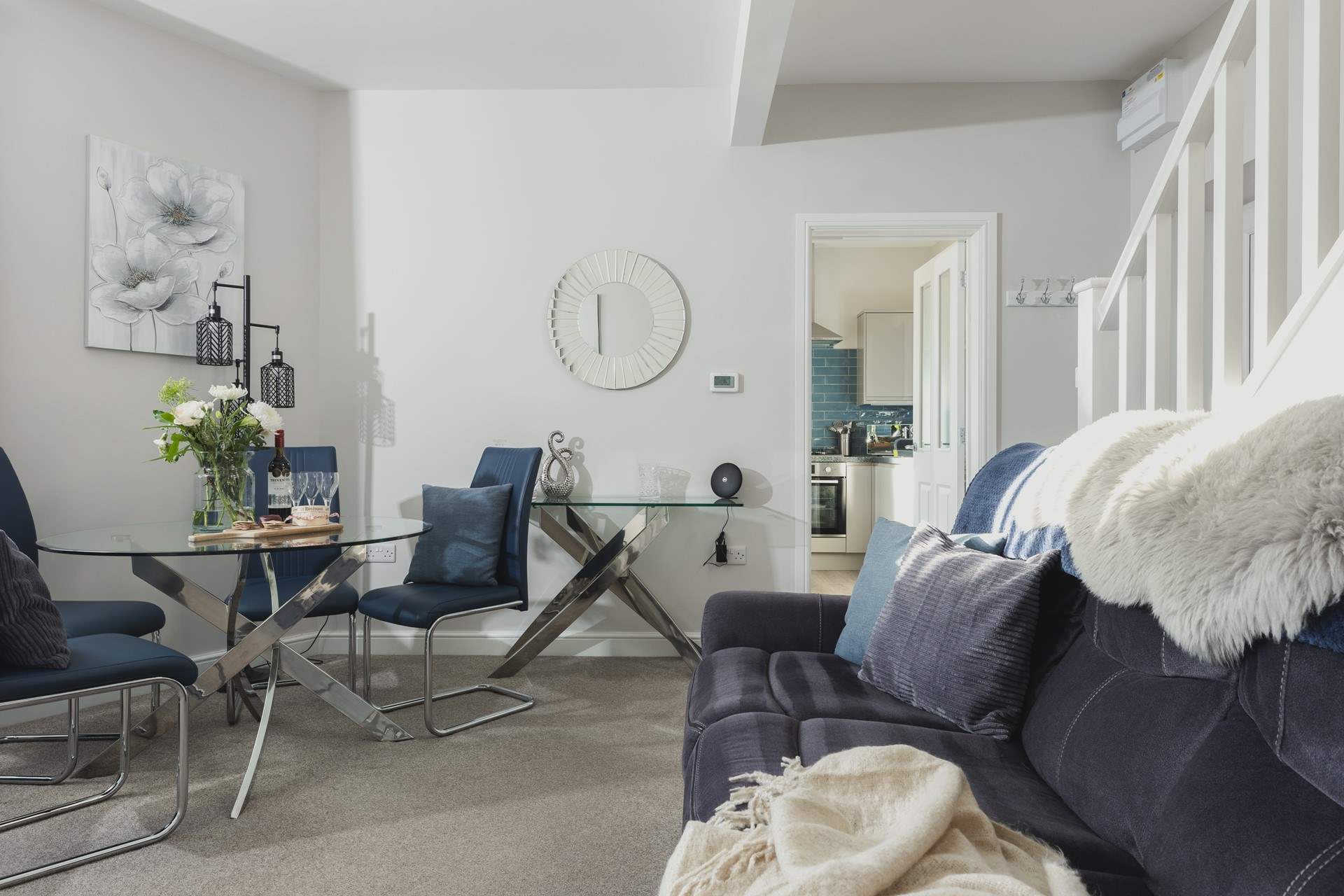 The kitchen leads off the sitting/dining-room.