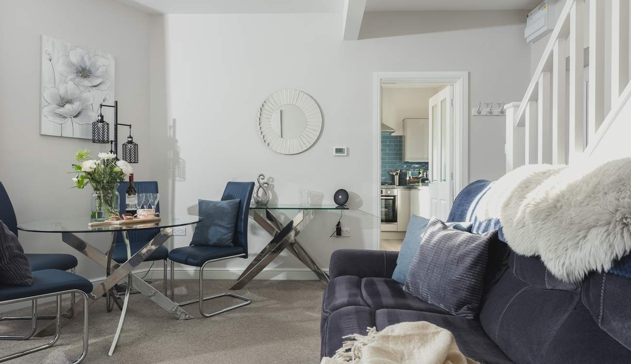 The kitchen leads off the sitting/dining-room.
