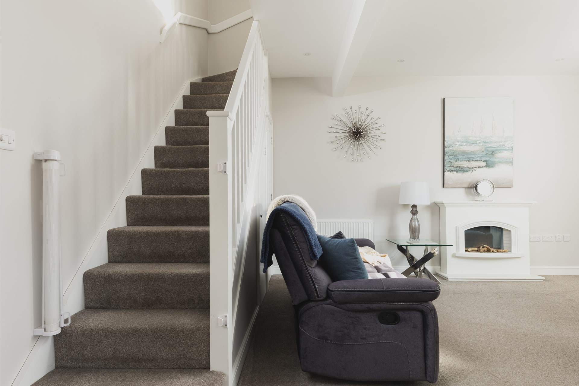 The stairs lead off up from the sitting/dining-room.