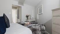 The main bedroom is home to this super comfy bed.