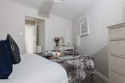 The main bedroom is home to this super comfy bed.