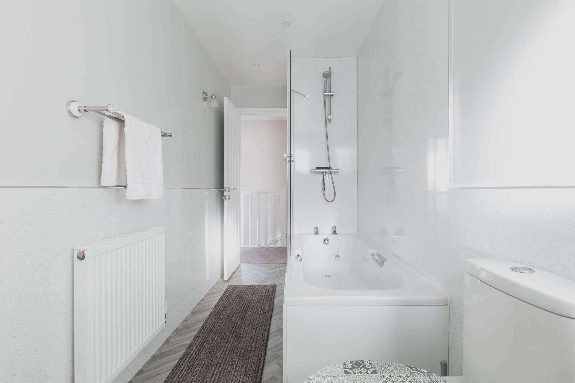 Wash away those sandy toes in the modern family bathroom.