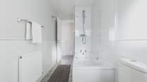 Wash away those sandy toes in the modern family bathroom.