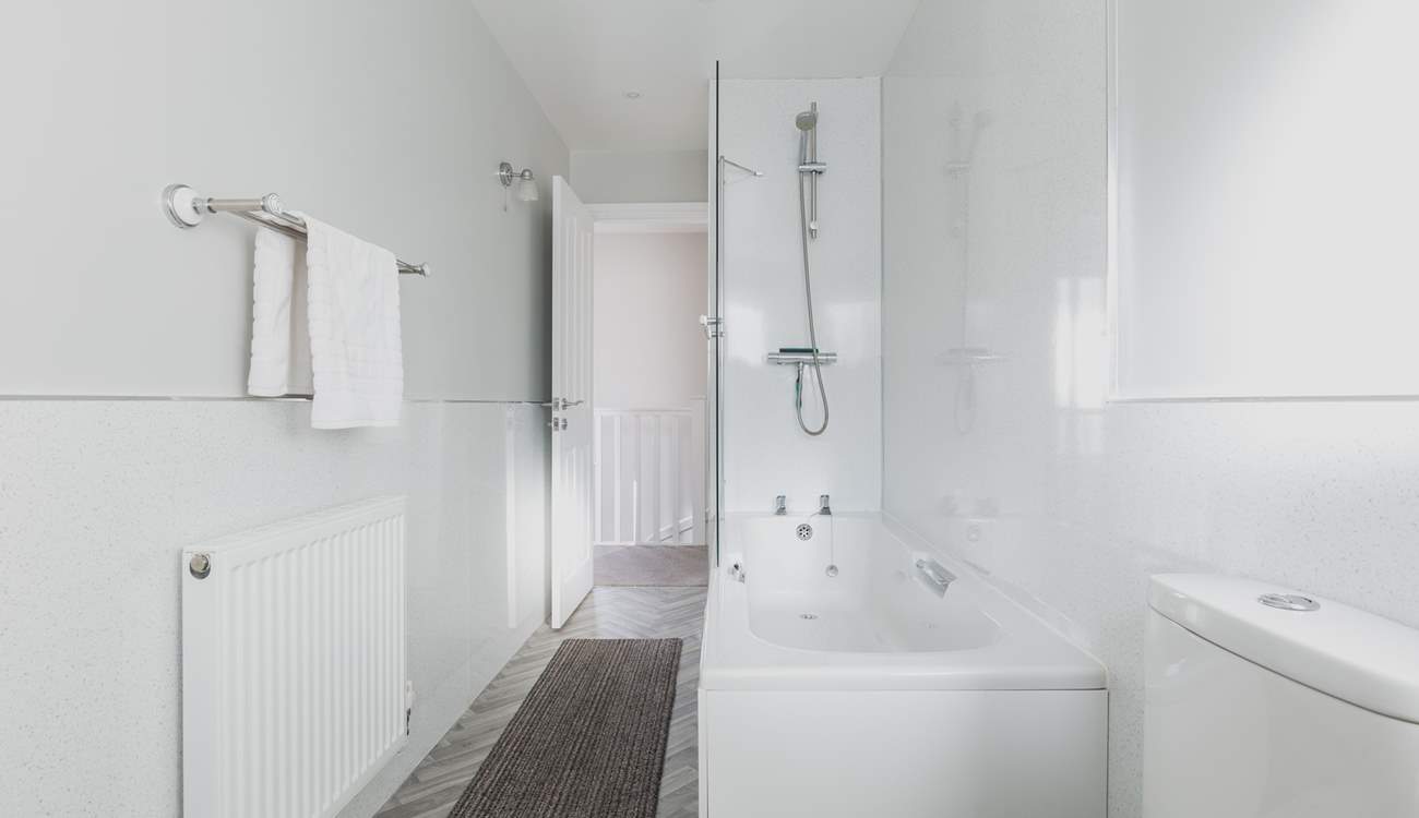 Wash away those sandy toes in the modern family bathroom.