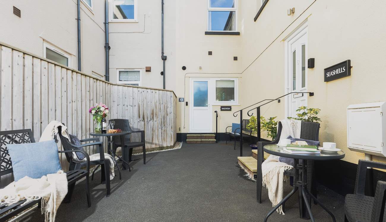 The entrance to Seashells is on the right. This is a shared courtyard entrance.