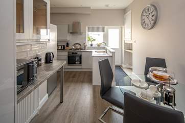 The kitchen also offers a space to sit and enjoy a snack or two.
