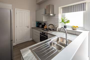 The kitchen is light, airy, and fully equipped for whipping up a feast.