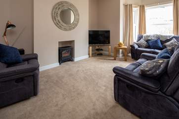 Snug living area with electric fire for those chillier evenings in.