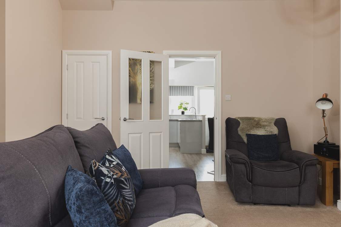 The sitting/dining-room leads directly into the kitchen/diner.