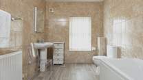 The modern family bathroom on the second floor.