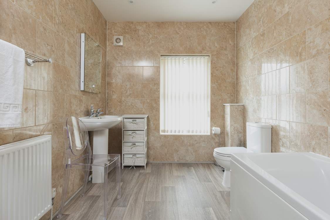 The modern family bathroom on the second floor.