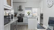 The kitchen is light, airy, and fully equipped for whipping up a feast.