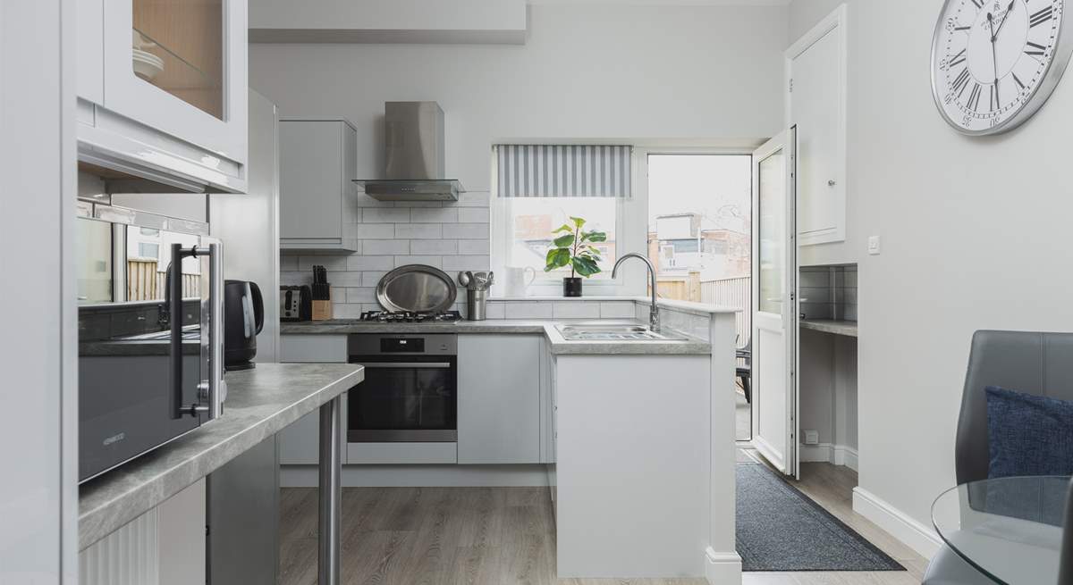 The kitchen is light, airy, and fully equipped for whipping up a feast.