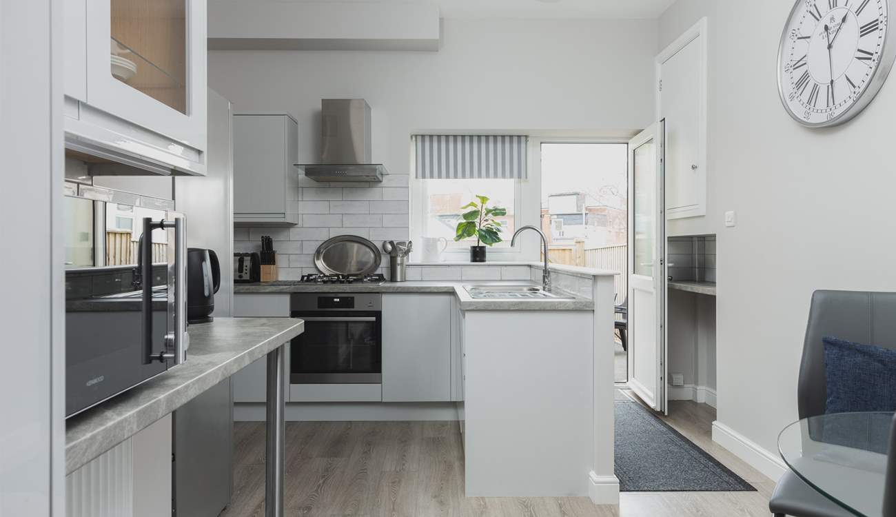 The kitchen is light, airy, and fully equipped for whipping up a feast.