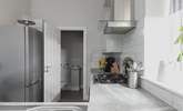 The kitchen leads off to the utility room. - Thumbnail Image