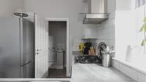 The kitchen leads off to the utility room.