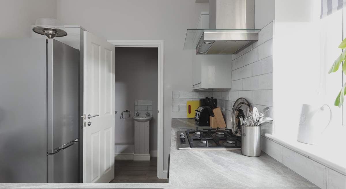 The kitchen leads off to the utility room.