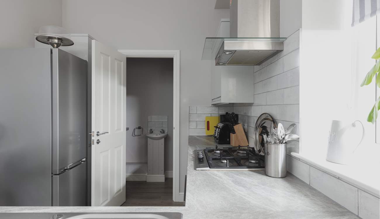 The kitchen leads off to the utility room.
