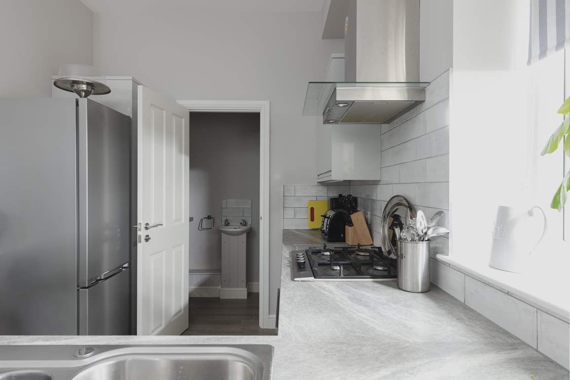 The kitchen leads off to the utility room.