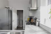 The kitchen leads off to the utility room.
