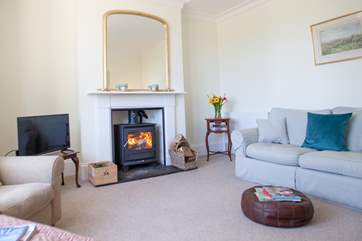 The second sitting-room with a cosy wood-burner.