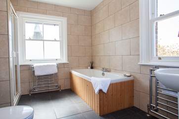The en suite bathroom with bath and shower cubicle.