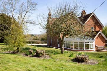 The large garden wraps around the house.