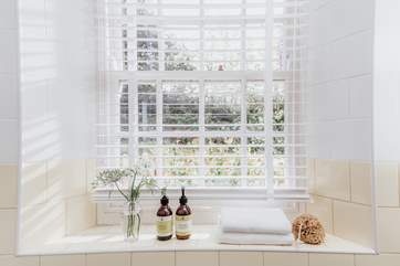 Light streams into the family bathroom.