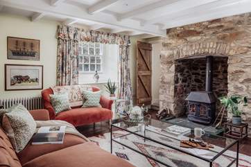 On winter days the sitting-room, complete with the original wood-burner, will be the heart of the home.