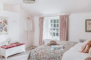 Bedroom 2, is a cosy space with a double bed and finished with a country-chic style.