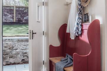 Arrive into a large hallway, with ample space for all of your holiday kit from welly boots to wetsuits, buckets to beach balls.